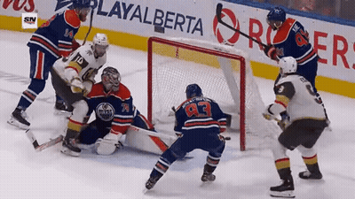 Hockey Game In Front Of PlayAlberta Banner GIF