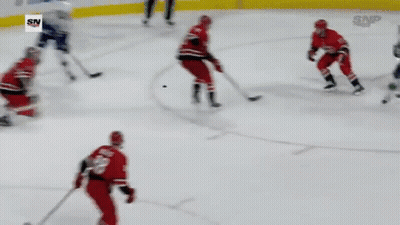Hockey Game In Front Of Progressive Banner GIF