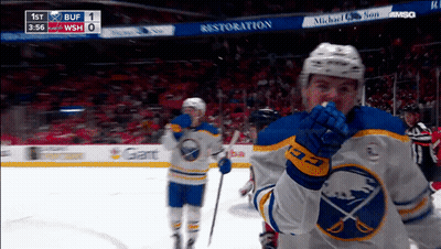 Hockey Game In Front Of Restoration Sign GIF