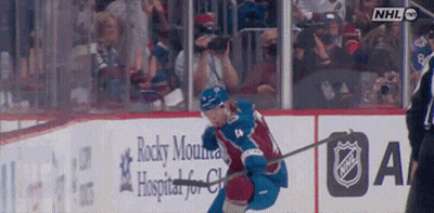 Hockey Game In Front Of Rocky Mountain Hospital Sign GIF