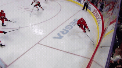 Hockey Game In Front Of Segrex Sign GIF