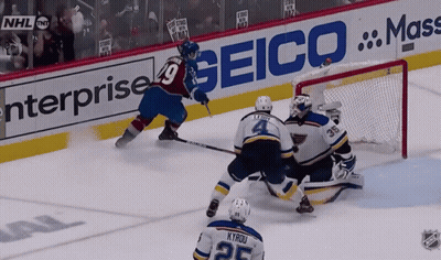 Hockey Game In Front Of Seico Ad GIF