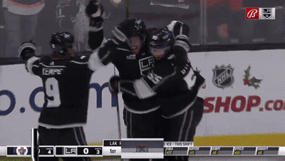 Hockey Game In Front Of Shop.com Sign GIF
