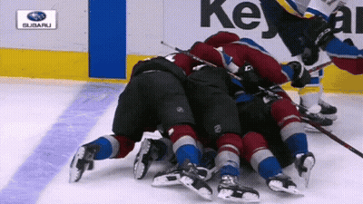 Hockey Game In Front Of Subaru Logo GIF