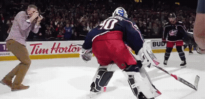Hockey Game In Front Of Tim Hortons Ad GIF