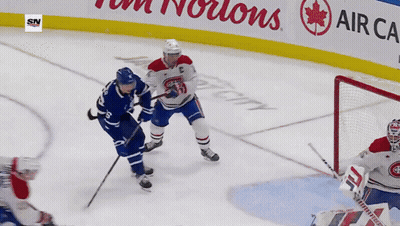 Hockey Game In Front Of Tim Hortons Sign GIF