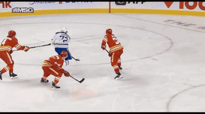 Hockey Game In Front Of Tim Hortons Sign GIF