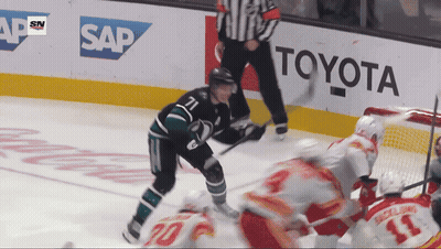Hockey Game in Front of Toyota Ad