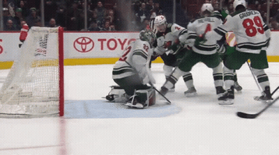 Hockey Game In Front Of Toyota Sign GIF