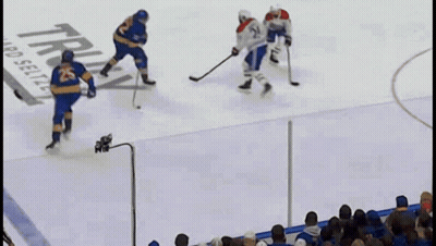 Hockey Game In Front Of Truly Hard Seltzer Ad GIF
