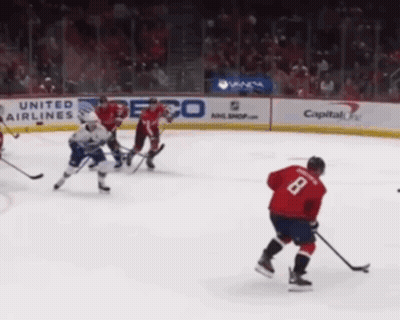 Hockey Game In Front Of United Airlines Ad GIF