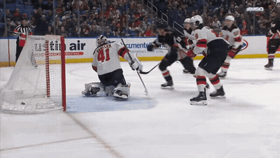 Hockey Game In Front Of Utility Air Ad GIF