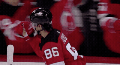 Hockey Game in Front of Verizon Advertisement
