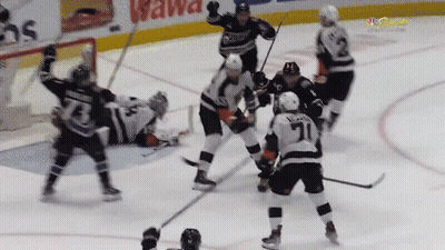 Hockey Game In Front Of Wawa Sign GIF