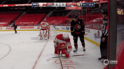 Hockey Game In Stadium Sponsored By Coca-Cola And Pizza Pizza GIF