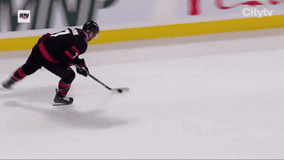 Hockey Game in Stadium With Ford Ads