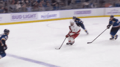 Hockey Game on Rink with Bud Light Ads