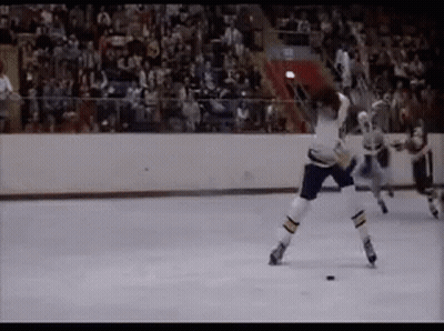 Hockey Game On Rink With Crowd GIF