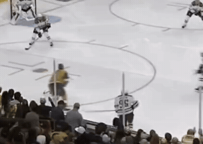 Hockey Game On Rink With Crowd GIF