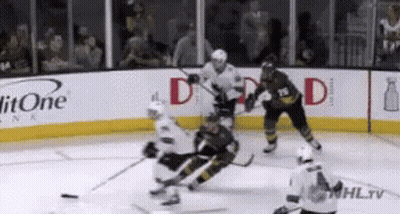 Hockey Game On Rink With Litone Advertisements GIF