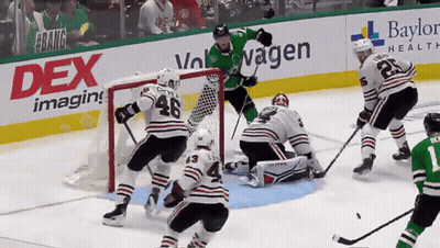 Hockey Game Played In Front Of Dex Imaging Banner GIF