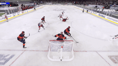 Hockey Game With Cat Ad On Ice GIF