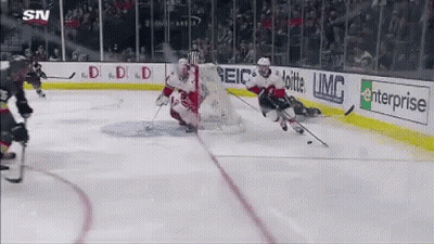 Hockey Game With Enterprise And Geico Ads On Ice GIF