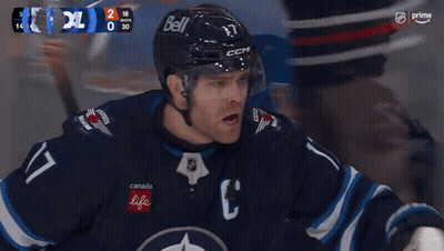 Hockey Game With Goal Shown On Screen GIF