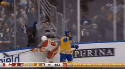 Hockey Game With Purina Ad On Ice GIF