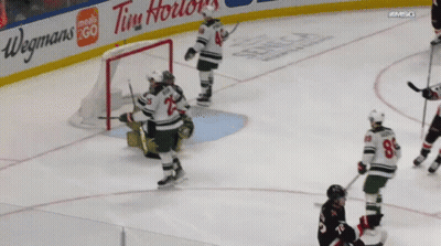 Hockey Game With Tim Hortons And Wegmans Ads GIF