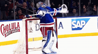 Hockey Goalie In Front Of Cholula Hot Sauce Ad GIF