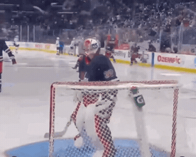 Hockey Goalie In Front Of Net With Gatorade Bottle GIF