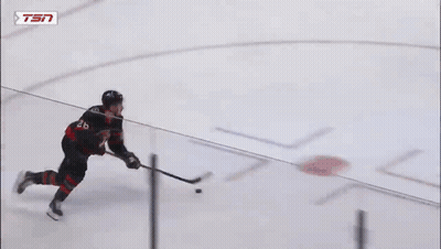 Hockey Goalie Kneeling In Front Of Tim Hortons Sign GIF