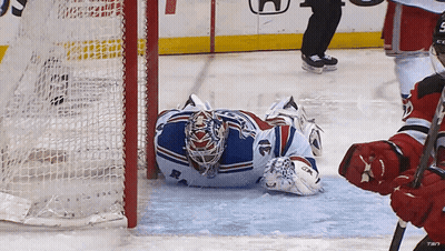 Hockey Goalie Laying On Ice With CCM Glove GIF