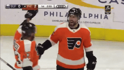 Hockey Goalie With Letter B Jersey In Front Of KDL Advertisement GIF