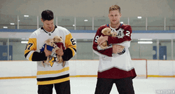 Hockey Nathan McKinnon Carrying Cute Little Dogs GIF