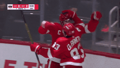 Hockey Player #23 Hugging Another Player GIF