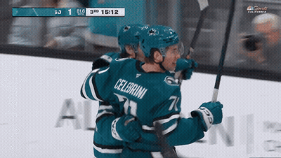 Hockey Player Celebroni Hugging Another Player GIF