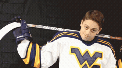 Hockey Player Holding Bauer Hockey Stick Over Shoulder GIF