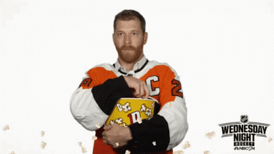 Hockey Player Holding Popcorn Wednesday Night Sign GIF