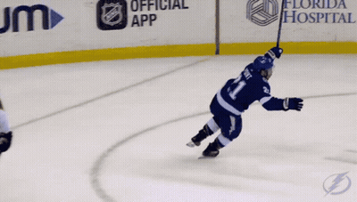 Hockey Player Holding Puck GIF