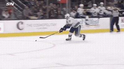 Hockey Player Holding Puck GIF