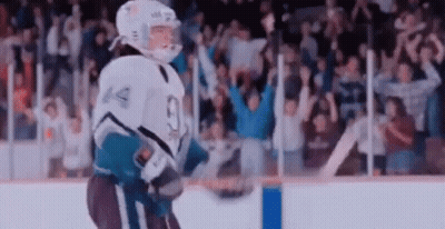 Hockey Player Holding Puck On Ice GIF