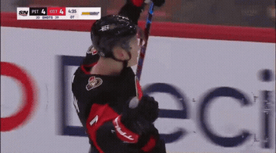Hockey Player Holding Stick Up GIF
