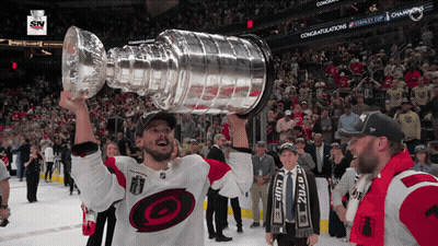 Hockey Player Holding Trophy GIF