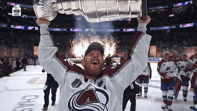 Hockey Player Holding Trophy GIF