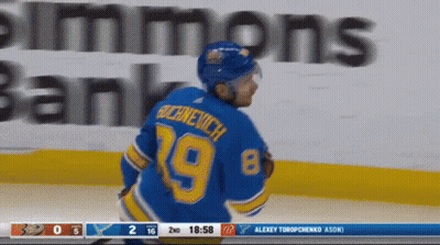 Hockey Player In 18 Jersey Beside Another GIF