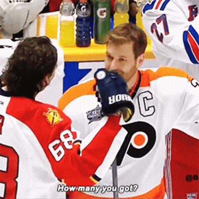 Hockey Player In 68 Jersey Talking To Another GIF