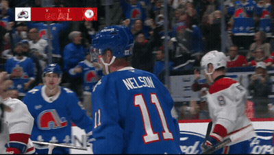 Hockey Player In Blue Jersey Number 11 GIF