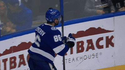 Hockey Player In Blue Jersey Number 2 GIF
